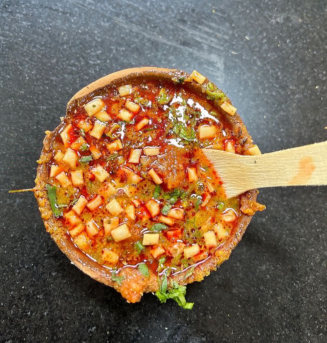 Tamatar chaat is a spicy preparation consisting of tomatoes mixed with asafoetida, pounded ginger, green chillies and spices with the addition of boiled potatoes