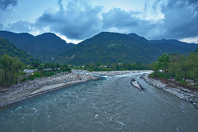 Shutterstock : A swelled mountain brook due to rains in Dehradun