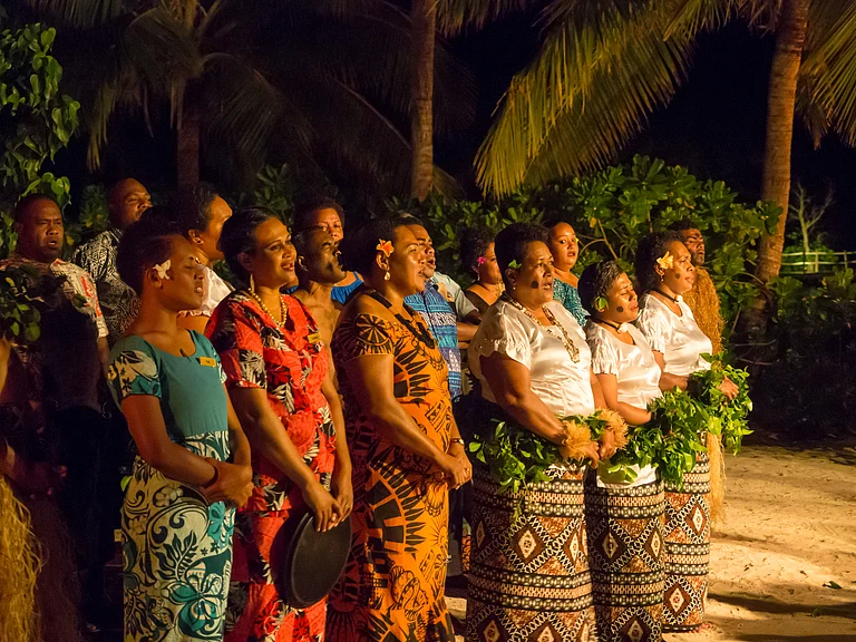 Women singing in Malolo Island, Fiji - Guy Cowdry/Shutterstock