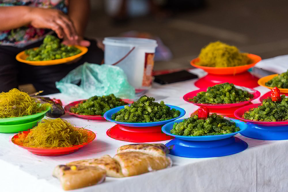 Heaped plates of Nama in a market in Fiji