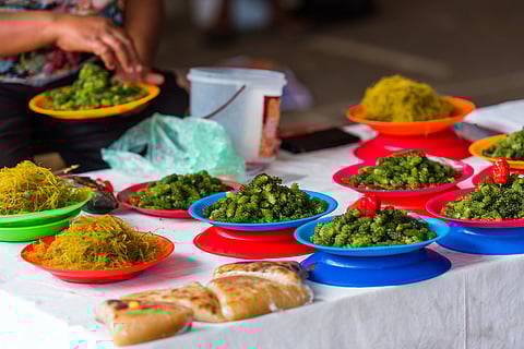 Heaped plates of Nama in a market in Fiji