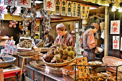 Vendors preparing chestnuts for sale at the Nishiki Food Market