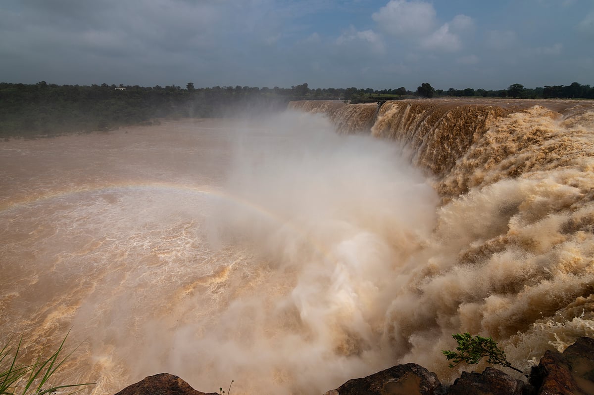 A rainbow forms at Chitrakoot Waterfalls