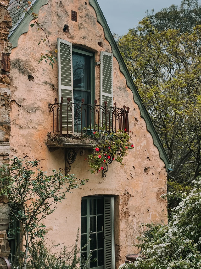 Historic stone building in Montsalvat, Eltham, a Victorian-era castle in suburban Melbourne - Shutterstock