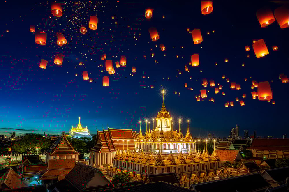 Lanterns fly over the Grand Palace in Bangkok, Thailand during the Yi Peng Festival 