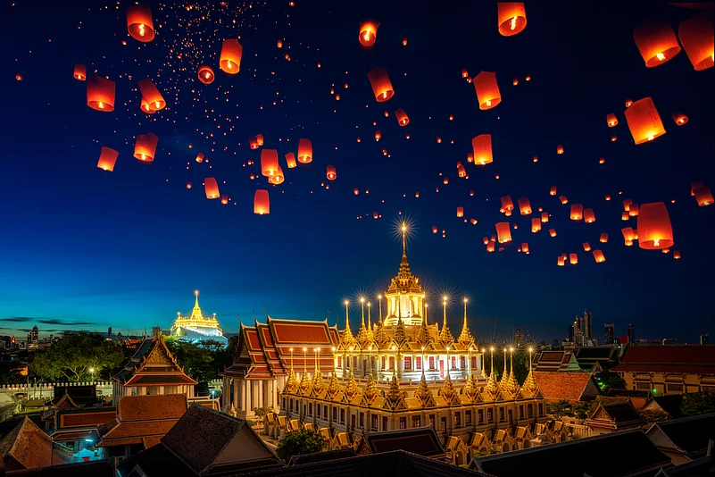 Lanterns fly over the Grand Palace in Bangkok, Thailand during the Yi Peng Festival