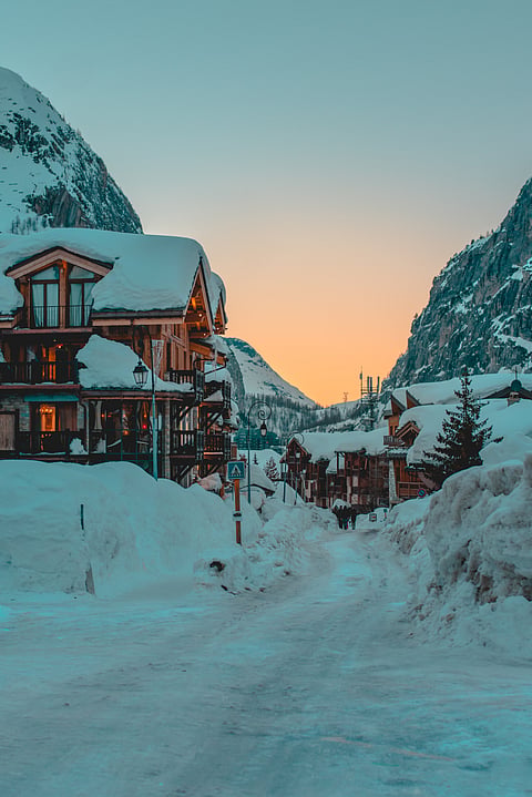 The sun goes down in a snowcovered Val d'Isere, France
