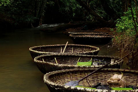 Coracle boats float on the Gavi Lake