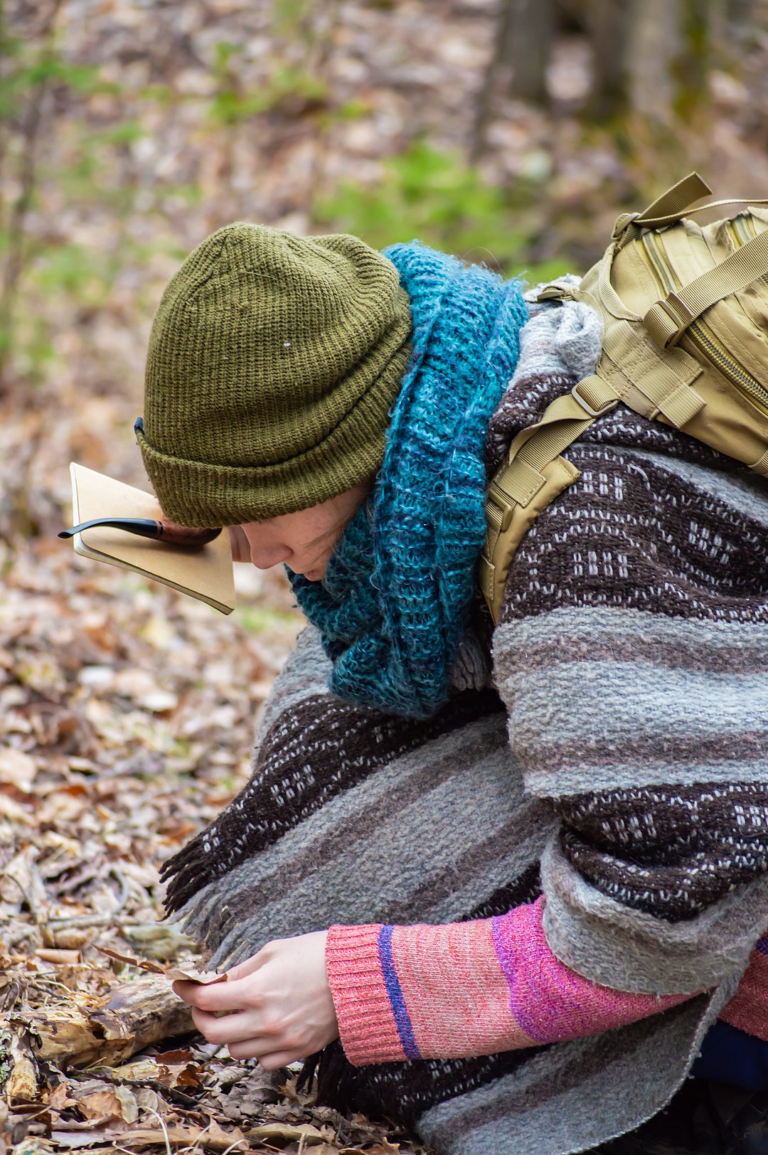 A woman wearing layered clothes on a hike
