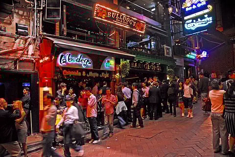 Hoardes of people outside night clubs in Hong Kong