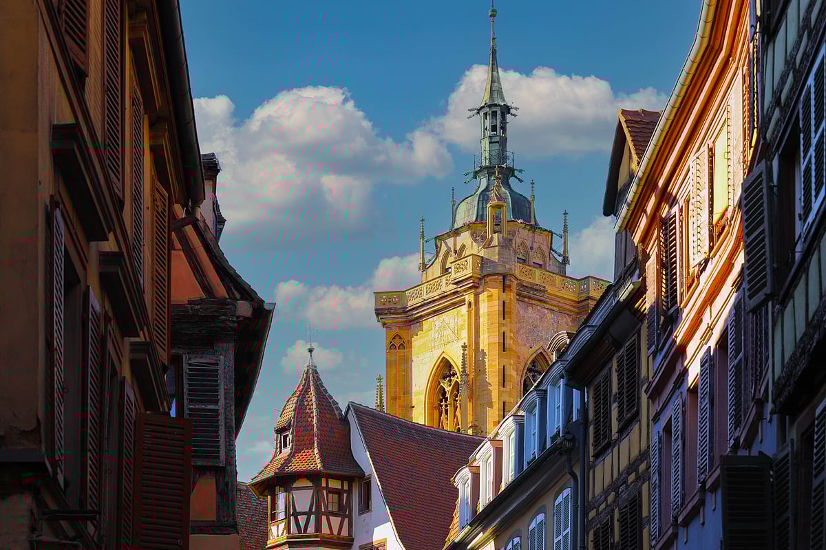 Traditional half-timbered houses on street in Colmar, Alsace region, France