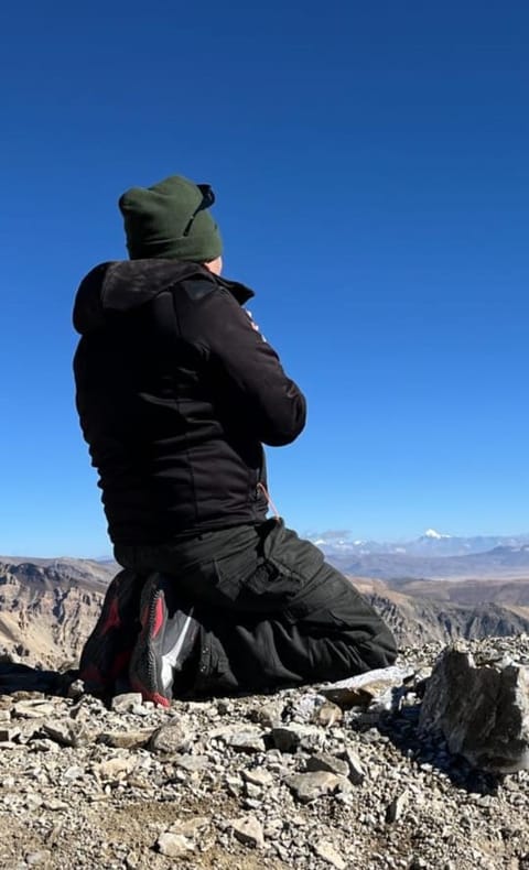 A pilgrim prays to Mt Kailash