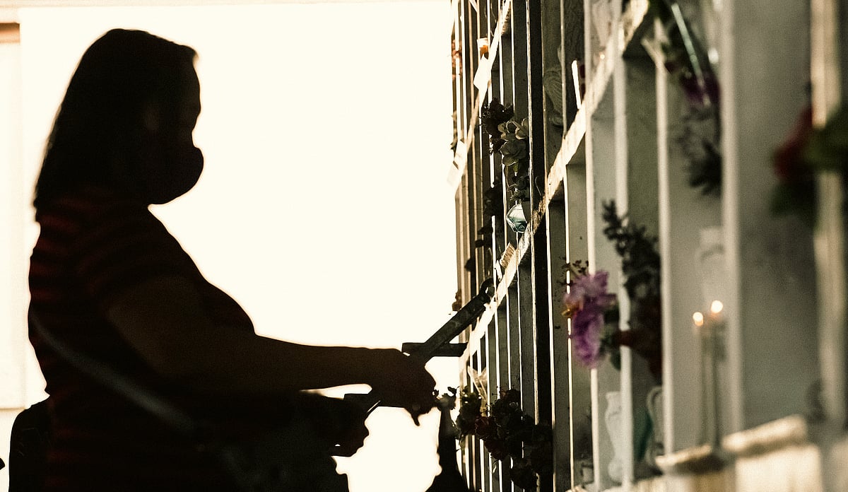 Families visit cemeteries to clean and decorate graves during Undas