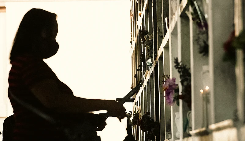 Families visit cemeteries to clean and decorate graves during Undas