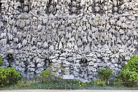 From a distance, the Dripstone Wall seems to be dripping skulls