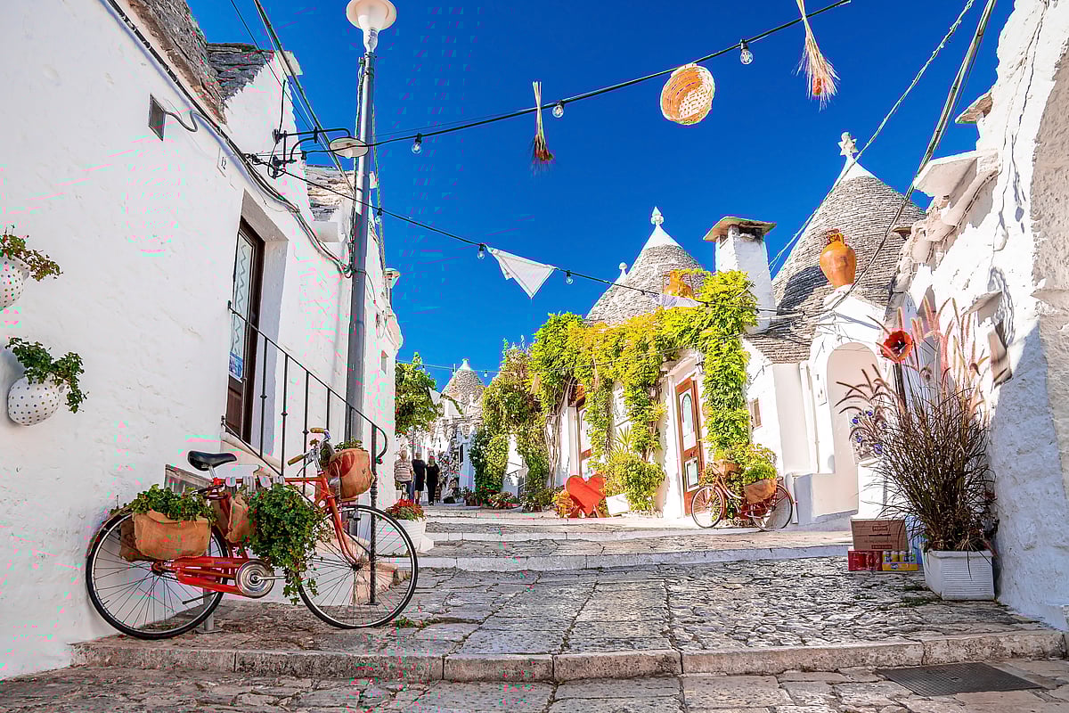 Shutterstock : Alberobello resembles a storybook village because of its whitewashed structures
