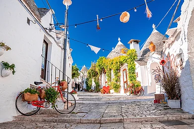Shutterstock : Alberobello resembles a storybook village because of its whitewashed structures