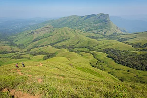 Vivek BR/Shutterstock : Trekking at Kudremukh or Kudremukha National Park in Chikmagalur, Karnataka