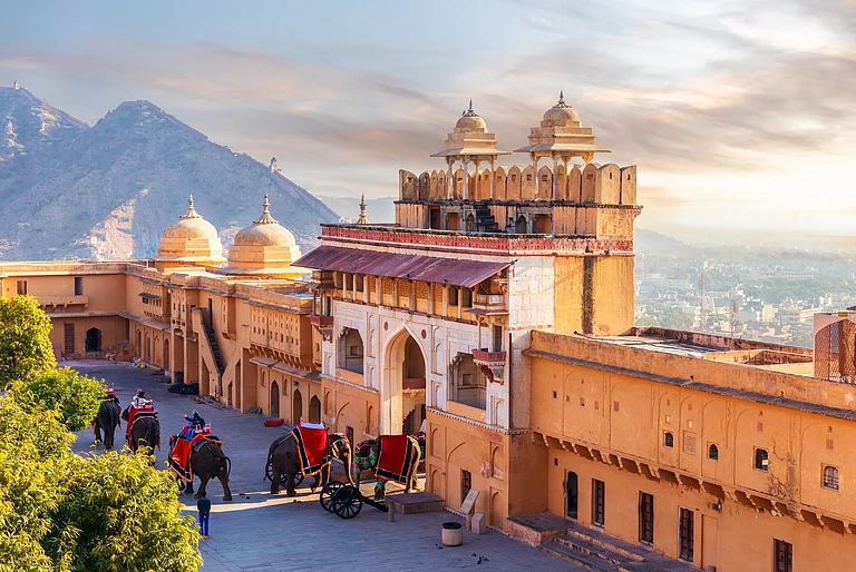 Elephant riders in Amber Fort, famous tourist attraction of Jaipur - Shutterstock