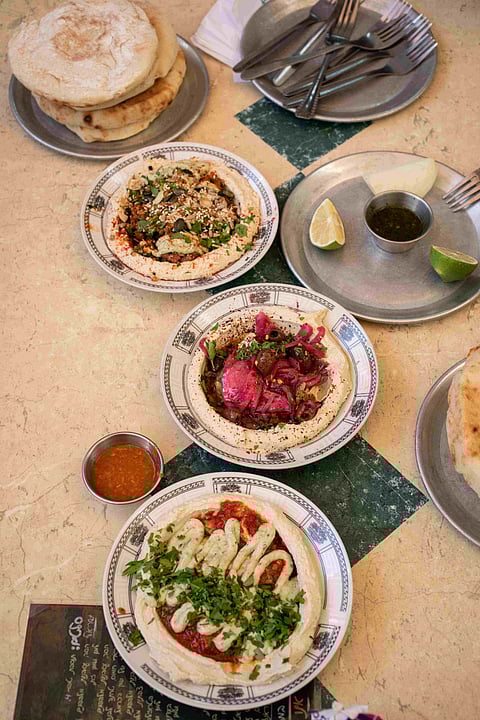 Dive into local specialties like fresh hummus, savory burekas, and sweet kanafeh