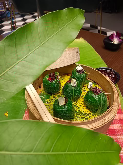 Pokchoy wrapped steamed sorshe bhetki