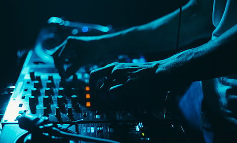 A low lit bar with techno music