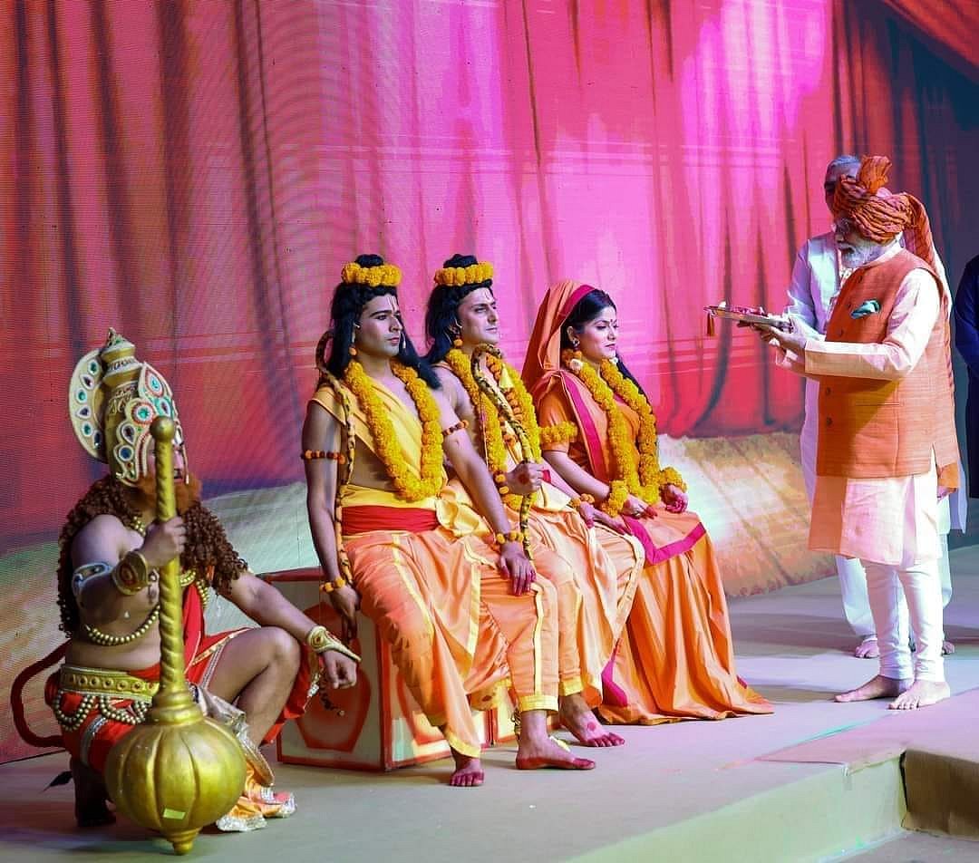 Prime Minister Narendra Modi (right) felicitating performers of the Ramleela performance in Dwarka, 2023