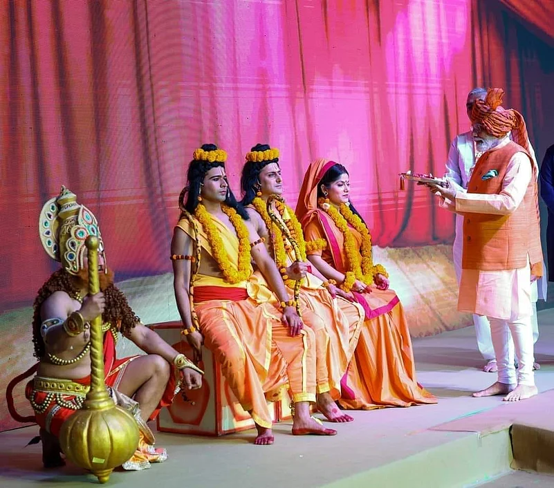 Prime Minister Narendra Modi (right) felicitating performers of the Ramleela performance in Dwarka, 2023