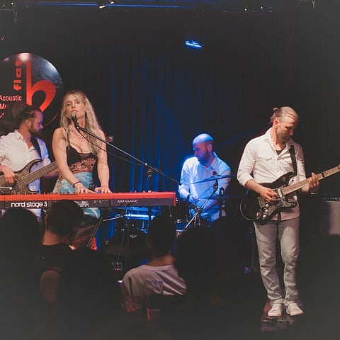 The b flat Acoustic Music and Jazz Club is a brick-walled space that hosts performances by local and international artists