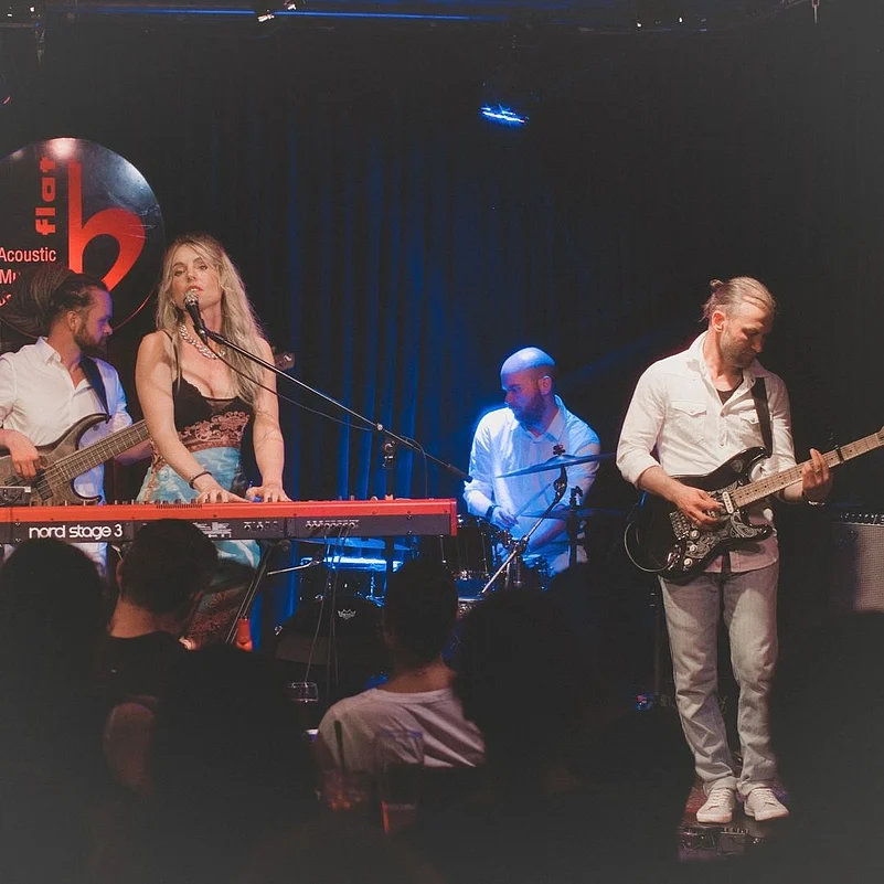 The b flat Acoustic Music and Jazz Club is a brick-walled space that hosts performances by local and international artists