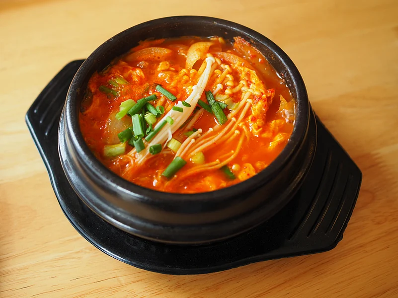 A bowl of spicy kimchi jjigae