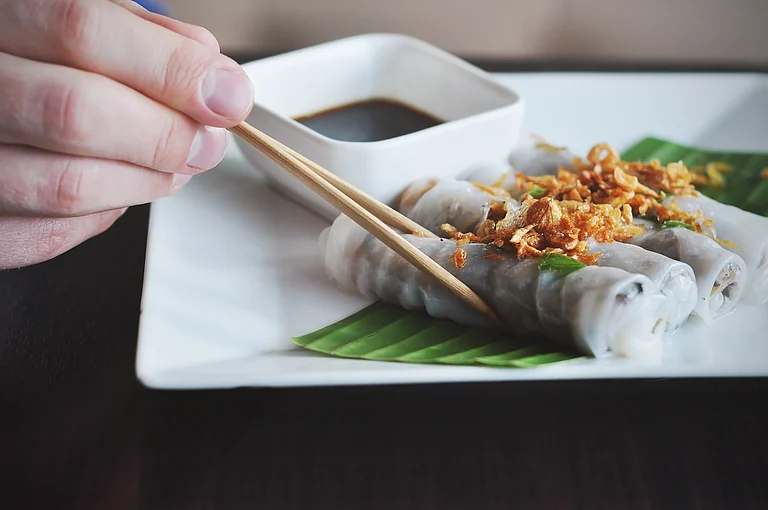 Bánh cuốn are delicate rice rolls filled with ground pork and mushrooms - Savvapanf Photo/Shutterstock