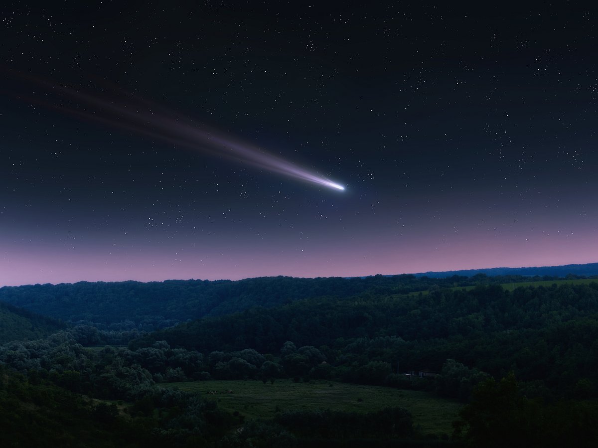Comet tail in the night landscape