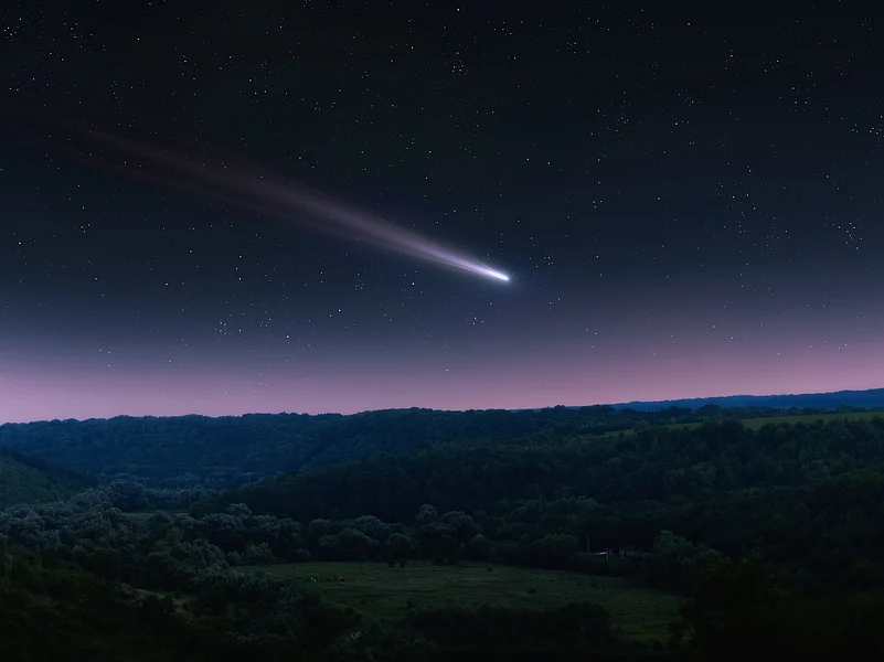 Comet tail in the night landscape