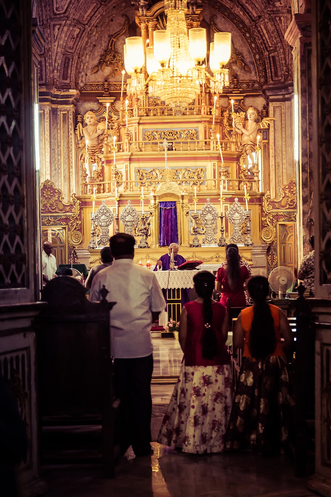 People pray at the Cathedral of Santa Catarina in Old Goa during Christmas