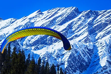 Peppy Graphics/Shutterstock : Paragliding in the Solang Valley near Manali