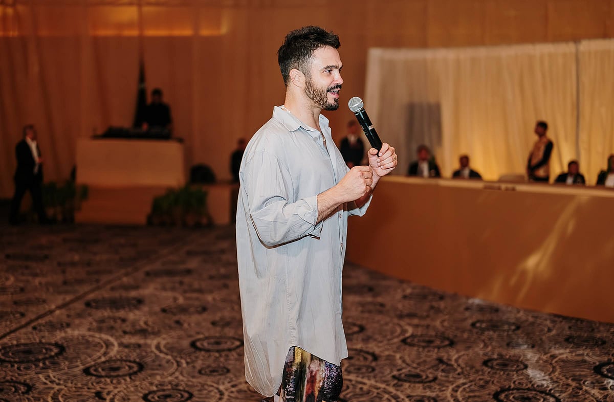 Chef Caique Tizzi speaks at the event