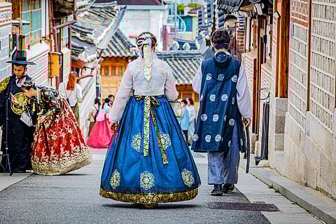 People dressed in traditional Korean clothes (hanbok) in Bukchon Hanok Village