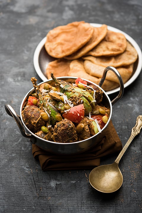 Undhiyu served with puri