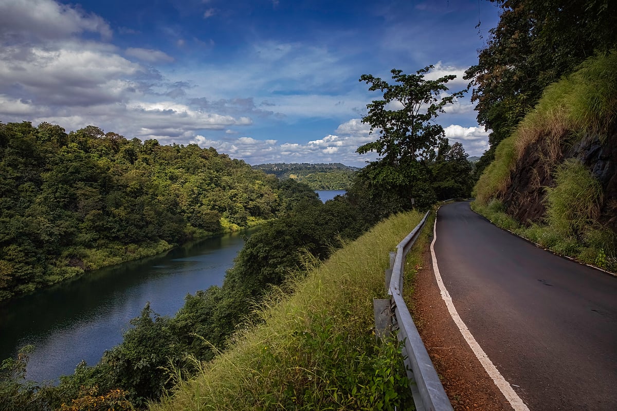 Vaitarna River backwater filling the valley running parallel to the road to Vihigaon in Maharashtra