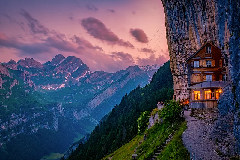Swiss Alps and a mountain restaurant under the Aescher cliff