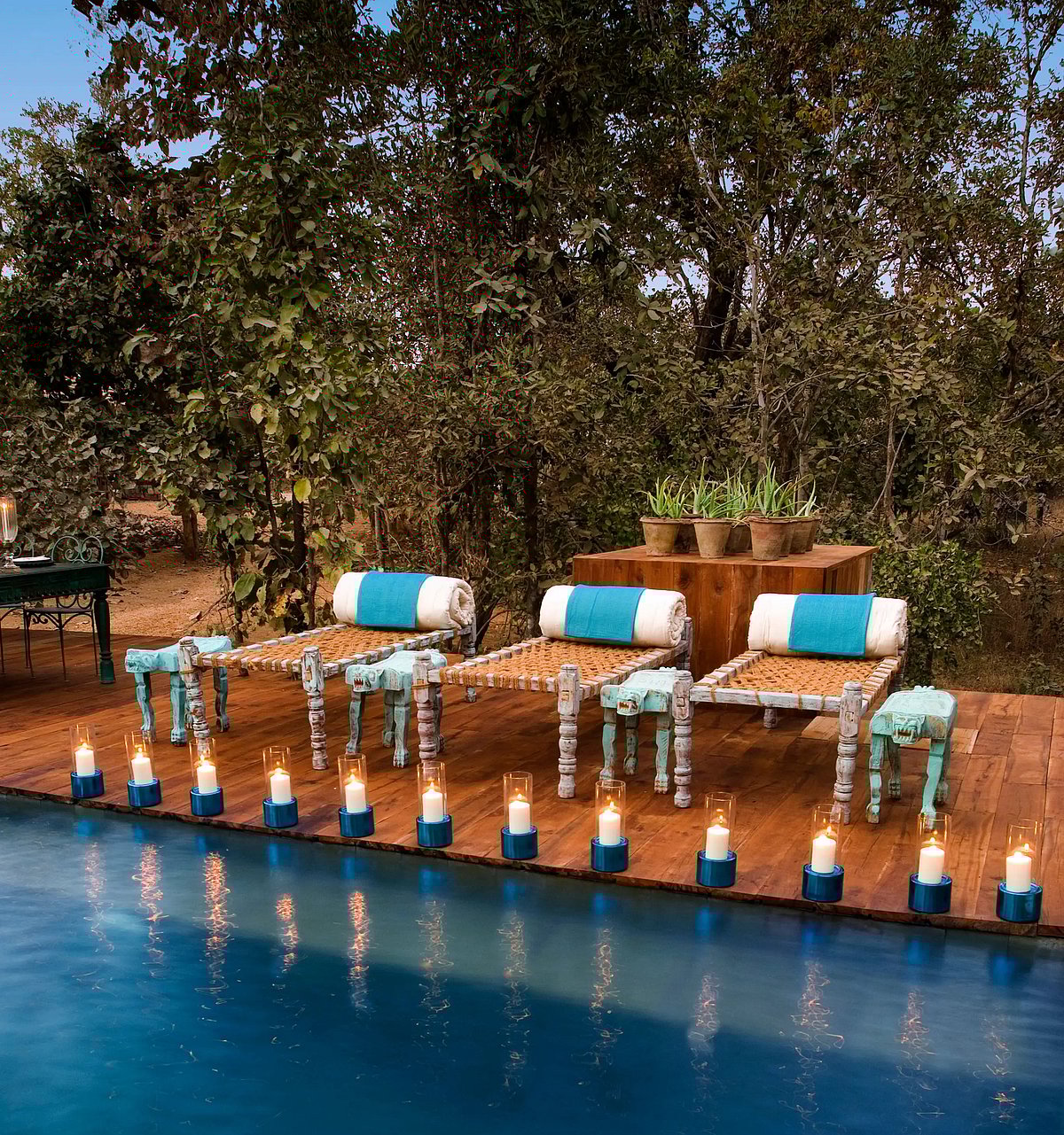 Baghvan, A Taj Safaris outdoor pool has relaxing charpoys