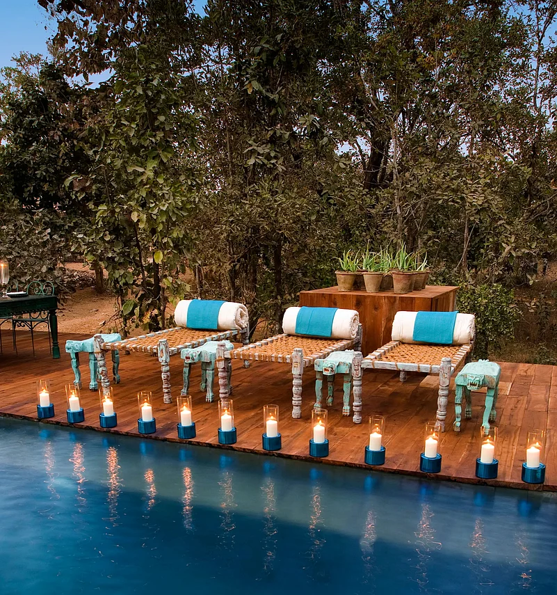 Baghvan, A Taj Safaris outdoor pool has relaxing charpoys