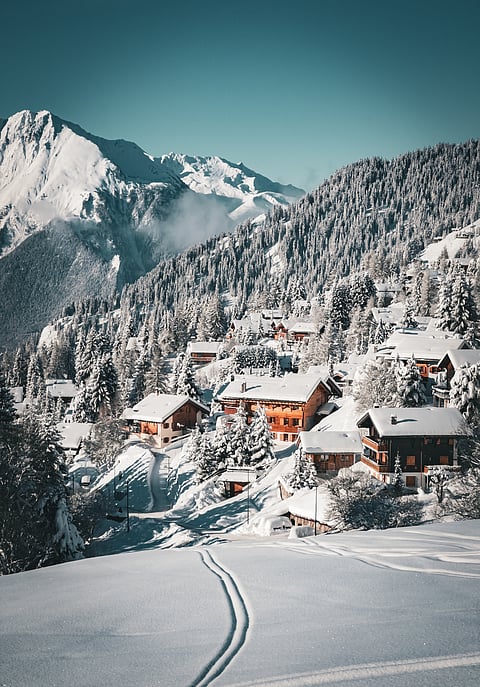 Under the glistening snow, Verbier nestles in the majestic arms of the mountains