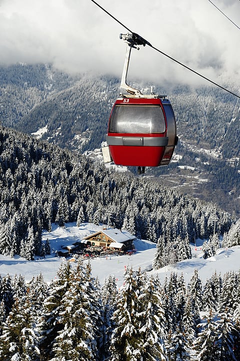 Vintage ski gondolas over Courchevel Ski Resort in St. Moritz