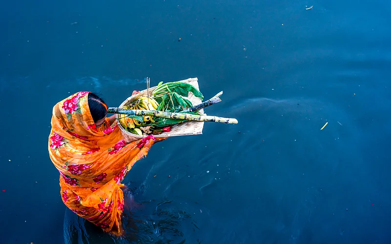 A vratin offers the arghya