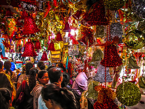 People shop for Christmas decorations in Margao