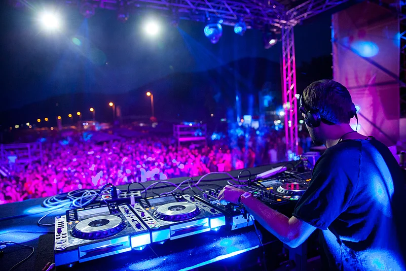 A DJ plays live music to an audience