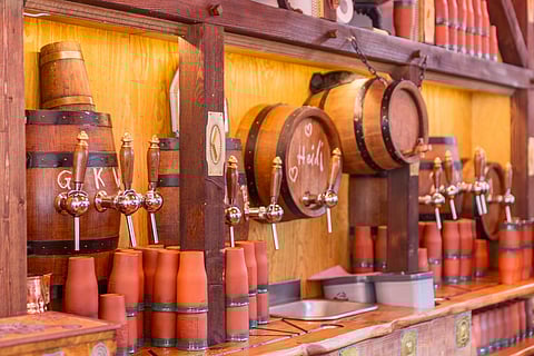 A steaming mug of glühwein (mulled wine) served in specially decorated mugs is a must during your tour of the Striezelmarkt