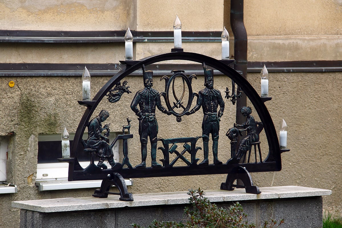 The Schwibbogen candle holder represents the arched entrance to a mine hung with guiding lights